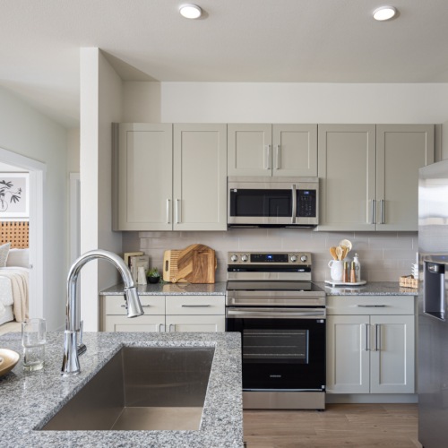 Kitchen with Island and Smart Stainless Steel Appliances