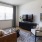 a living room with a tv and couches