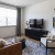 a living room with a tv and couches