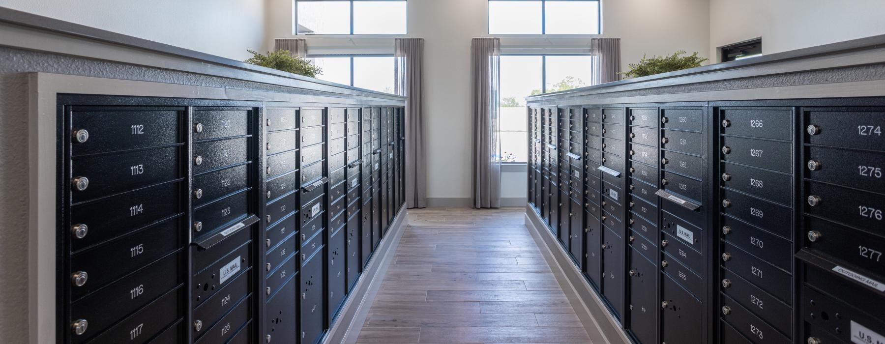 a room with black mail cabinets and black drawers